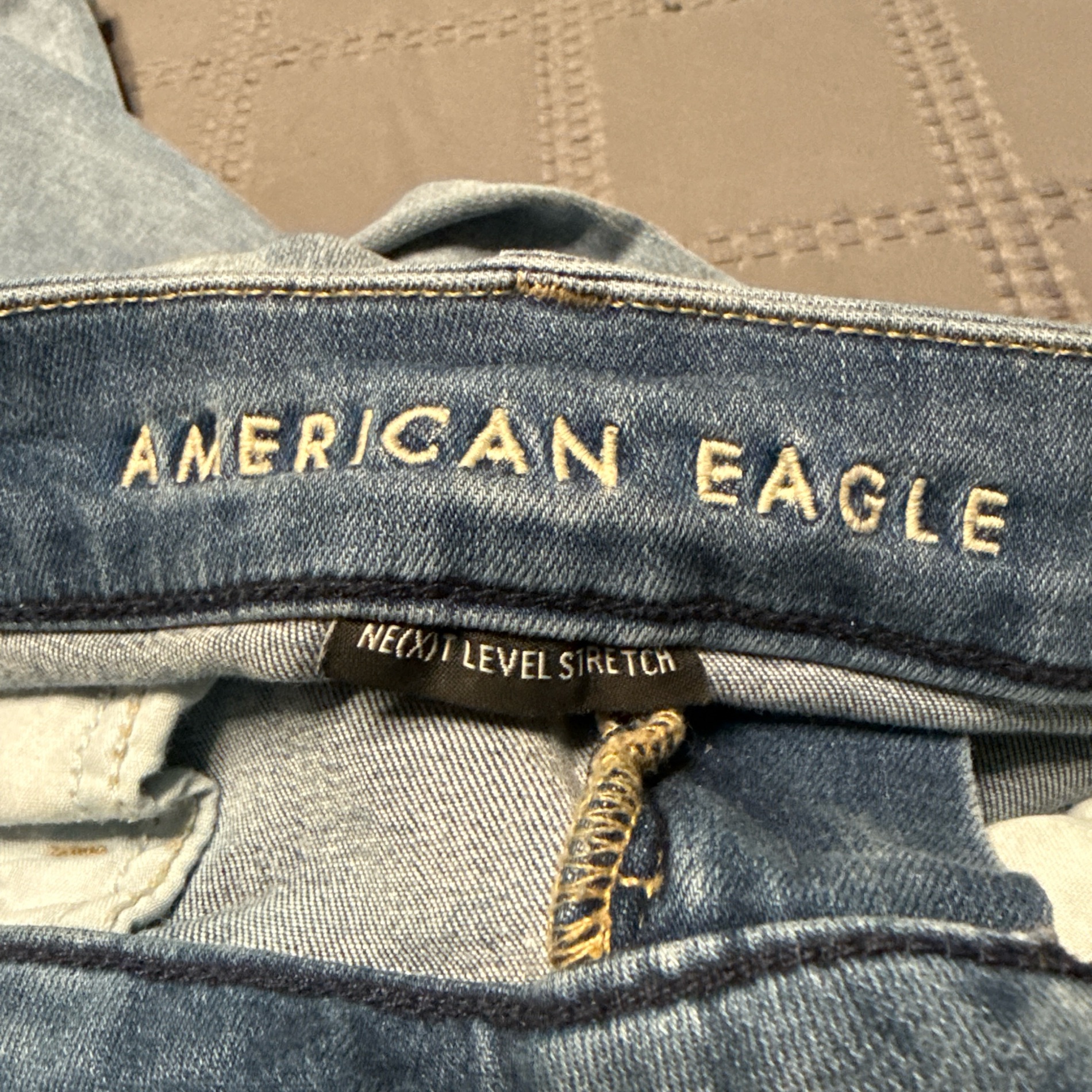American Eagle Next-Level Stretch Ripped Jeans - Size 8 photo