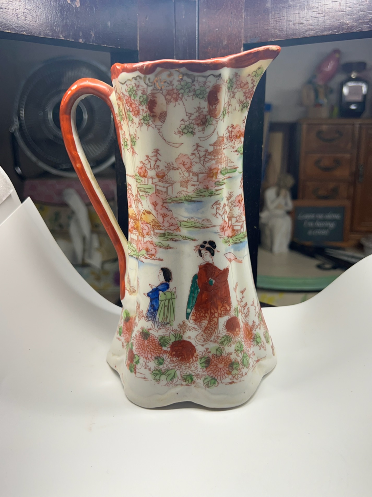 Asian-Inspired Ceramic Pitcher with Floral Designs