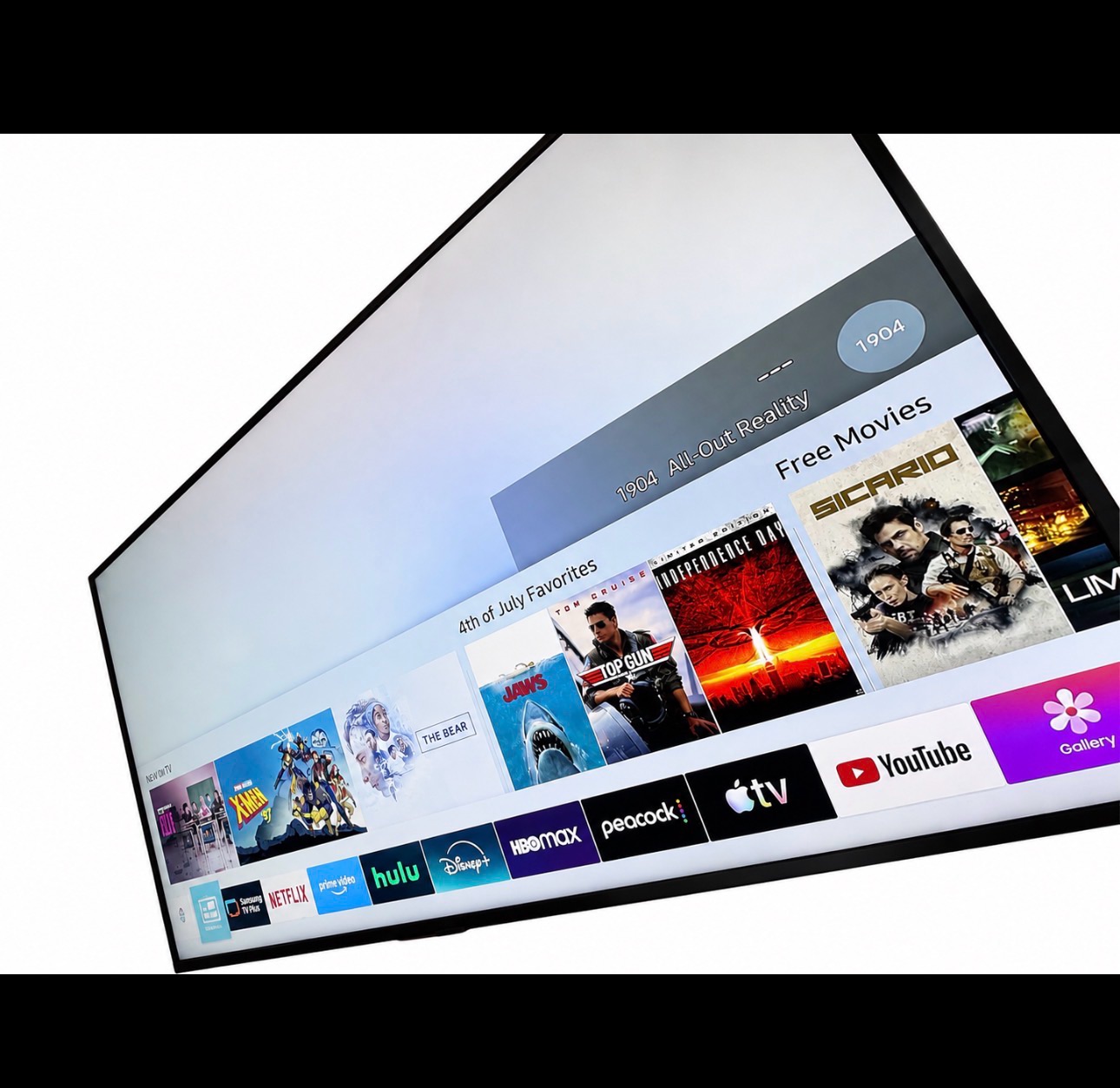 Samsung 4K Smart TV with Soundbar and Subwoofer photo