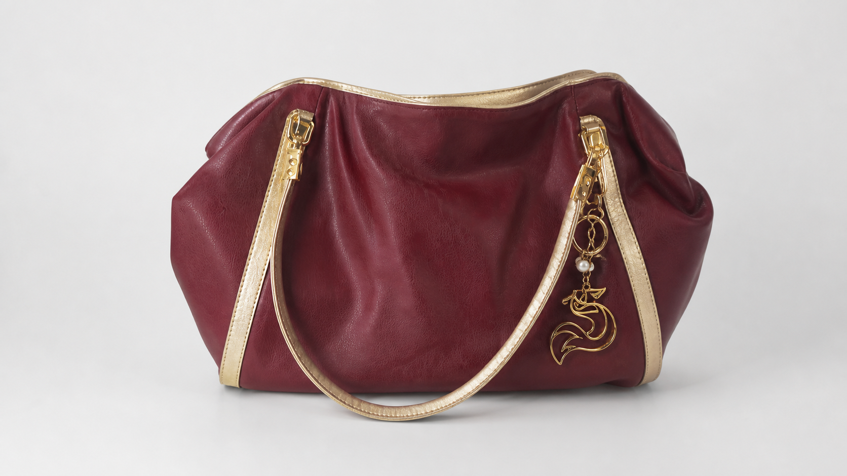 Elegant Red Leather Handbag with Gold Accents