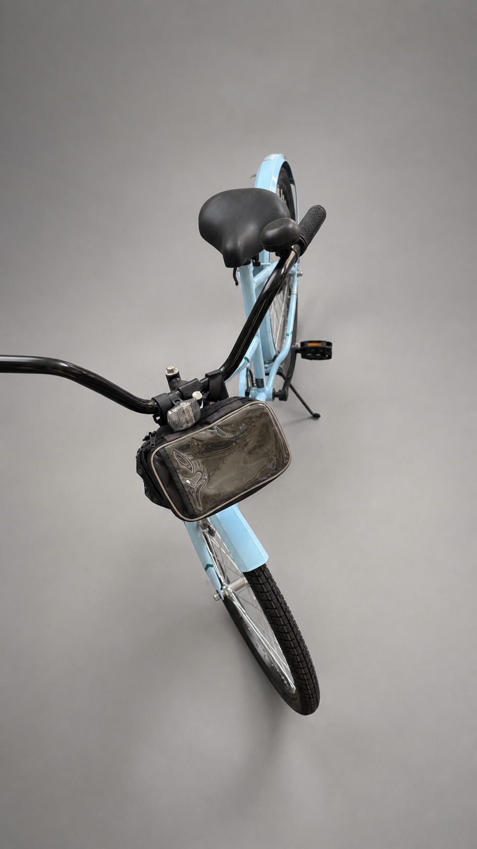 Light Blue Cruiser Bicycle with Handlebar Bag