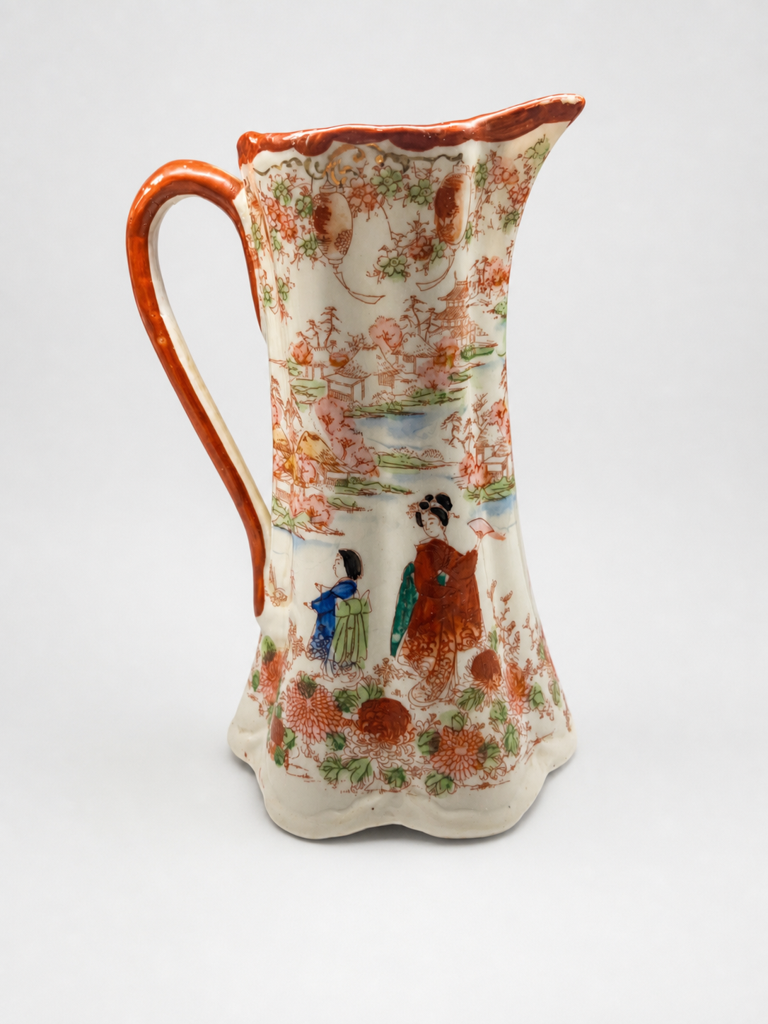 Asian-Inspired Ceramic Pitcher with Floral Designs